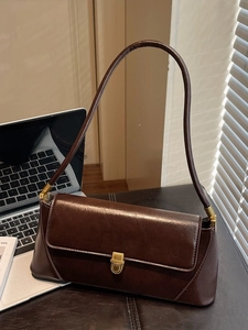 Minimalist vintage dark brown leather baguette bag with a stylish gold square clasp