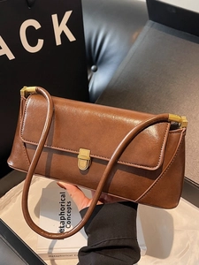 Brown vintage baguette bag with gold metal buckle and sleek PU leather texture