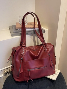 Large capacity vintage red leather tote bag with rivet details and fringe zippers