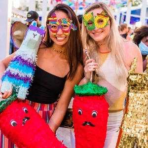 Cinco de Mayo party set with colorful piñatas and festive Fiesta eyewear props