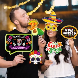 Festive Mexican party photo booth props set with sugar skull and sombrero held by models