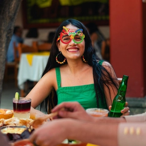 Detailed close-up of a festive Cinco de Mayo paper glasses with chili and sombrero motifs
