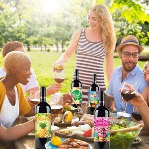 Close-up of vibrant Hawaiian party wine bottle stickers with tropical summer motifs