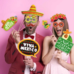 Colorful Mexican party photo booth props with paper hats and glasses for fiesta fun