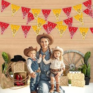 Western cowboy party bunting with red and yellow paisley banners in a desert setting
