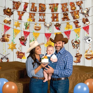 Western cowboy themed birthday party kit with WILD WEST banner and hanging swirl decorations