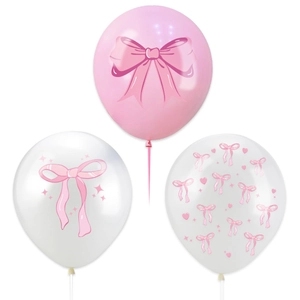 Detailed view of pink bow themed balloons with hearts and stars patterns for party decor