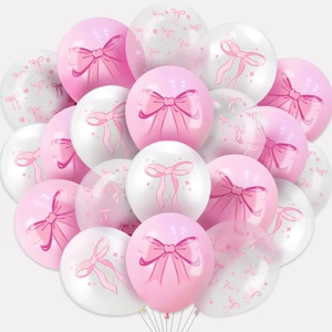 Detail of pink and white latex balloons with bow, heart, and star prints for parties