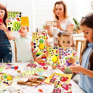 Kids and adults playing with DIY fruit face stickers including strawberry and pineapple