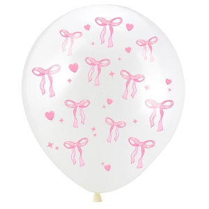 Detail of white party balloon featuring pink ribbons, hearts and star patterns