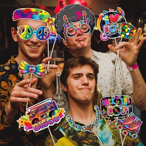 Detailed 80s disco party photo booth props with paper cutout retro glasses and boombox