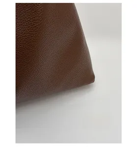 Macro shot of durable brown lychee grain leather with scratch-resistant surface