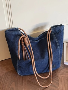 Large capacity vintage washed denim tote bag with brown woven rope strap and tassels