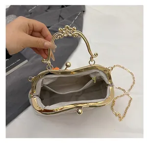 Detail of vintage evening bag interior showing zipper pocket and metallic chain strap