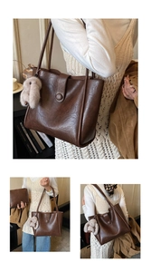 Detail view of vintage brown tote bag set with matching zipper pouch and plush bunny charm