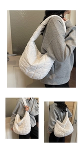 Detailed views of the white quilted puffy hobo bag showing shoulder wear and capacity