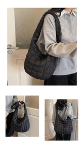 Detailed views of a black quilted puffer hobo bag showing texture and crossbody styling