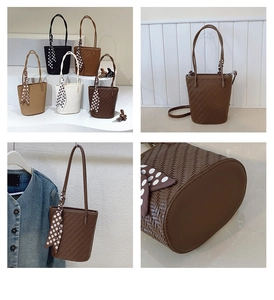 Detail of woven texture on bucket bag with polka dot scarf and adjustable strap