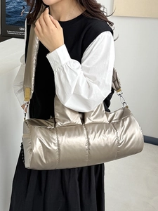 Metallic champagne quilted cylinder puffer crossbody bag with stylish wide shoulder strap