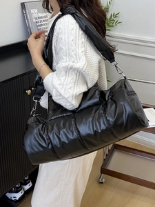 Stylish black quilted puffer shoulder bag with glossy nylon finish and spacious design