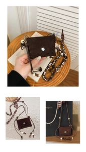 Detail of a dark brown mini suede crossbody bag with decorative beaded geometric strap