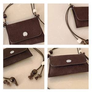 Detail shots of retro brown suede mini pouch with beaded strap and silver metal buckle