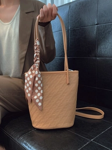 Minimalist herringbone weave tote bag with decorative polka dot scarf in brown
