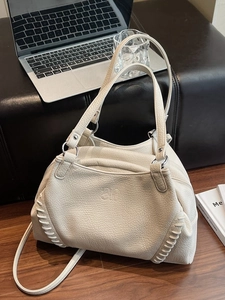 Cream lychee textured motorcycle tote bag with whipstitch details and dual straps