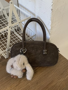 Retro dark brown suede bowling bag with dual handles and a cute bunny pendant charm