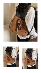 Close-up of vintage brown tote bag with leather logo and cute plush bear charm