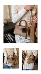 Close-up of brown woven bucket bag with metal buckle detail and plush pendant