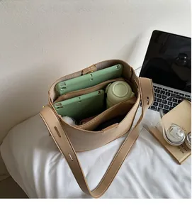 Interior view of apricot large capacity leather bucket bag with multiple compartments