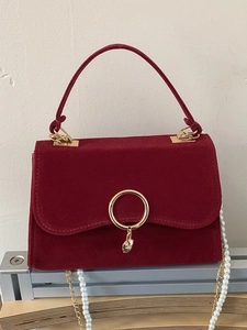 Elegant wine red velvet handbag with gold ring hardware and pearl chain strap