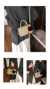 Detailed views of a mini two-tone bucket bag in matcha green leather and beige fabric
