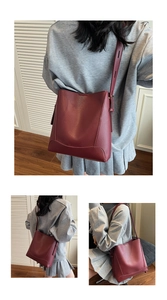 Detail of burgundy leather bucket bag with litchi texture and fine stitching work