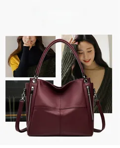 Macro shot of dark burgundy tote bag featuring lychee grain texture and vertical zippers