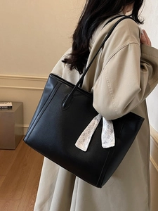 Minimalist black leather tote bag with silk scarf accessory for women daily commuting