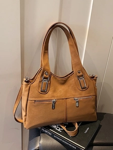 Brown vintage faux leather tote bag with silver zippers and detachable shoulder strap