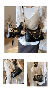 Detail showing two sizes of black retro chain dumpling bags with plush bear charms