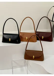 Detailed view of vintage baguette bags in four colors with elegant golden oval buckles
