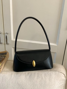 French vintage black baguette shoulder bag with matte leather and golden metal buckle