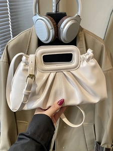 Chic beige pleated cloud tote bag with glossy finish and adjustable crossbody strap