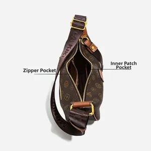 Detailed interior view of the brown monogram crossbody bag with zipper and slip pockets