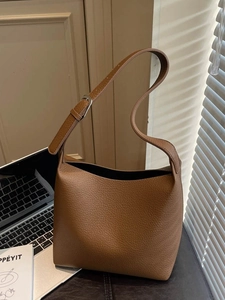 Brown lychee leather bucket shoulder bag with adjustable strap for daily commute