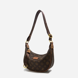 Detailed close-up of Hobo shoulder bag with monogram pattern and gold-tone buckle