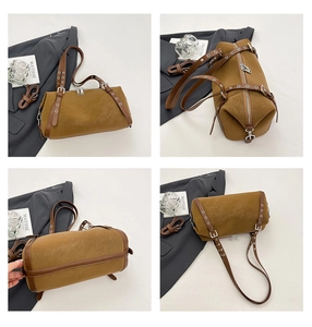 Detailansicht der braunen Nietentasche mit silbernen Schnallen und Wildleder-Finish