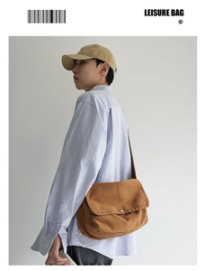 Brown canvas messenger bag for women worn by a model showcasing its large capacity and style