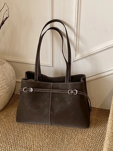 Minimalist deep brown leather tote bag with contrast stitching for women's daily commute