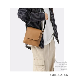 Brown leather crossbody bag detail with embossed logo and adjustable strap on model