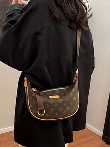 Retro monogram hobo bag in brown leather with gold hardware and curved crescent design